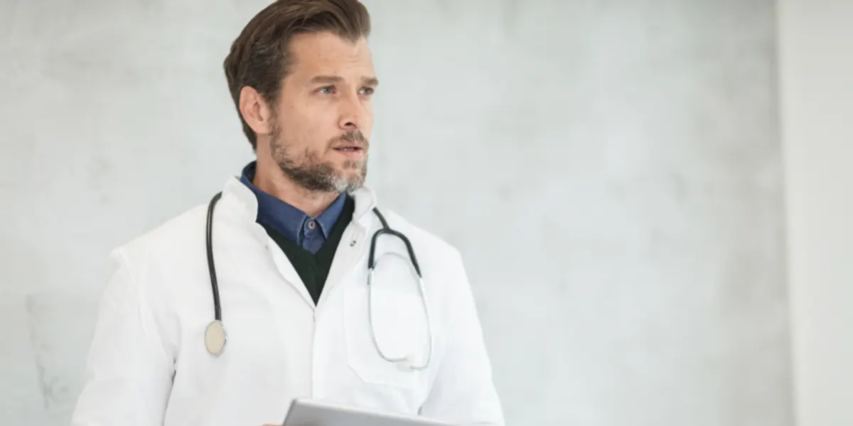 A doctor in a white coat with a stethoscope